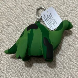 NWT - Bath & Body Works dinosaur clip on hand sanitizer holder.